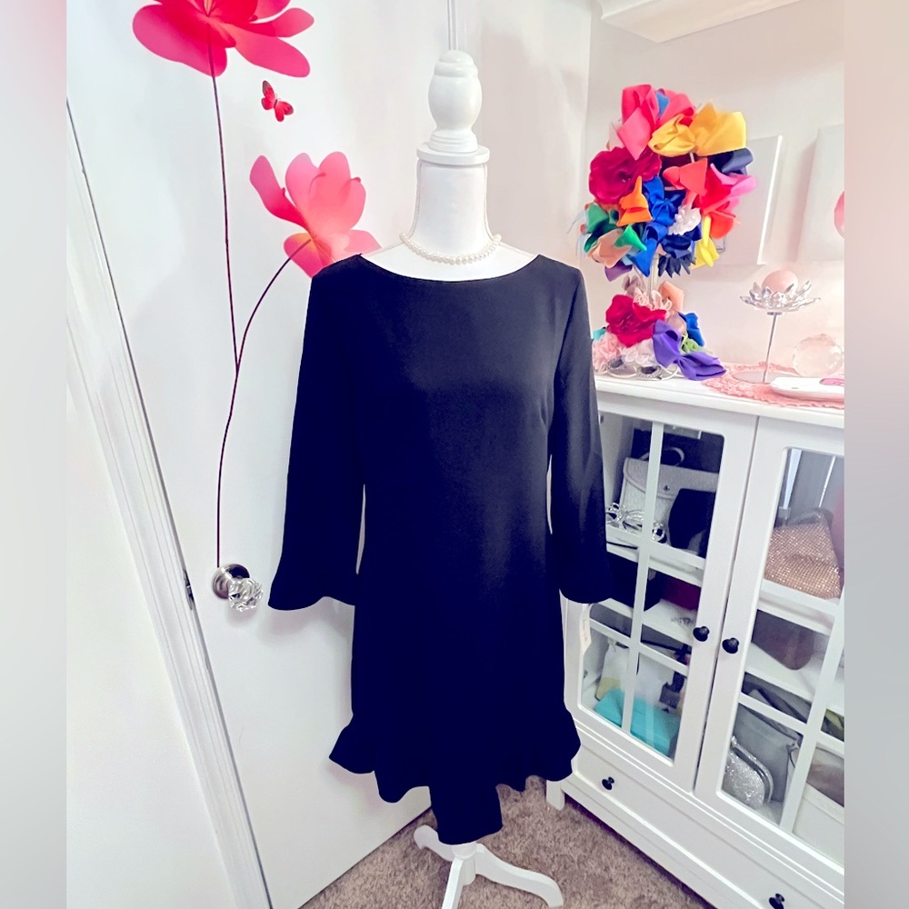 Black elegant dress. Ruffled Scalloped Sleeves. Never been worn.